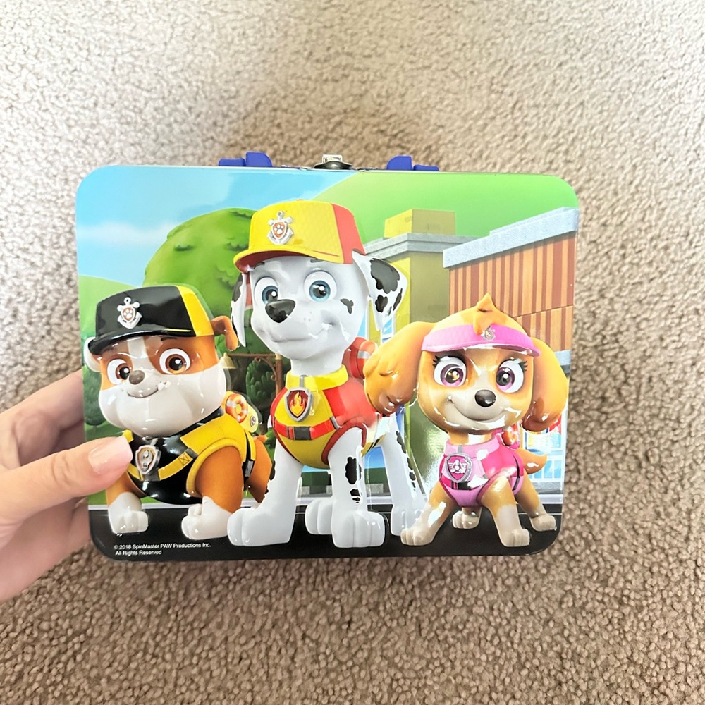6 puzzles and Paw Patrol metal container with handle